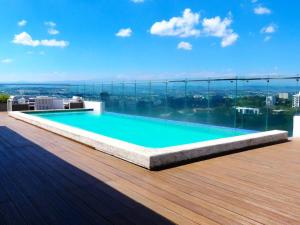a swimming pool on the roof of a building at Dreams Room Soha II in Santiago de los Caballeros