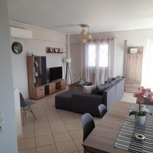 a living room with a couch and a table at Villa Ioulia Malakonda, Eretria ,Greece in Eretria