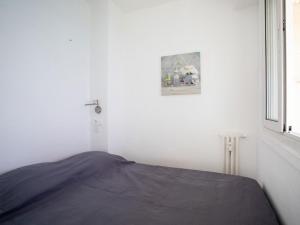 Ένα ή περισσότερα κρεβάτια σε δωμάτιο στο Apartment L'Angelina-1 by Interhome