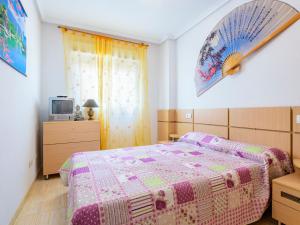 A bed or beds in a room at Apartment Marina d'Or - Costa Azahar I-1 by Interhome