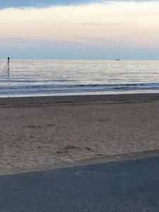 a beach with the ocean in the background at Happy Holiday apartments in Mablethorpe
