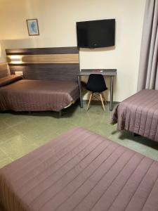 Postel nebo postele na pokoji v ubytování Hostal Meson Pepa