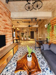 a living room with a couch and a table at SCENIC VALLEY 1 in Ho Chi Minh City