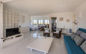 a large living room with a couch and a table at Azul in Sagres