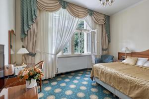 Postel nebo postele na pokoji v ubytování Hotel Romance