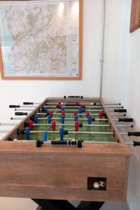 a foosball table in the corner of a room at Holiday Home Llety Clyd by Interhome in Dinas Mawddwy