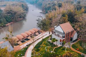 an aerial view of a building next to a river at VeeVaree Riverkwai Resort in Ban Kaeng Raboet