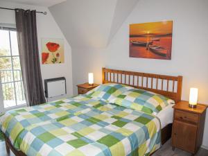 a bedroom with a bed and two lights on night stands at Apartment Gollwitzer Park - Insel Poel-7 by Interhome in Gollwitz