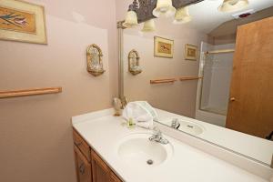 a bathroom with a sink and a mirror at 1240 Timber Lane home in South Lake Tahoe +17 photos