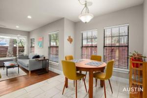 a living room with a table and chairs and a couch at Gorgeous Home in Heart of Zilker with Full Kitchen in Austin