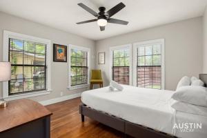 a bedroom with a bed and a ceiling fan at Gorgeous Home in Heart of Zilker with Full Kitchen in Austin
