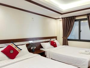 Postel nebo postele na pokoji v ubytování Sapa Brilliant Hotel