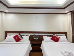 Postel nebo postele na pokoji v ubytování Sapa Brilliant Hotel