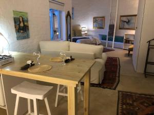a living room with a table and a couch at The Annex in Pringle Bay