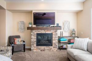 a living room with a fireplace with a flat screen tv at The Beach House townhouse in Washington