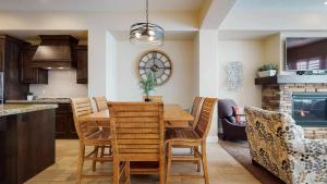 a kitchen and dining room with a wooden table and chairs at The Beach House townhouse in Washington