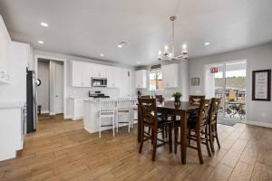a kitchen and dining room with a table and chairs at The Bend at Paseos in Washington