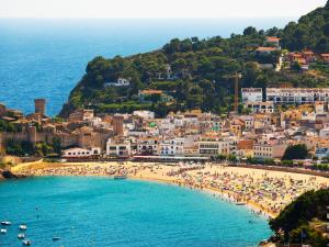 a view of a beach with people on it at Apartment Naranja by Interhome in Tossa de Mar
