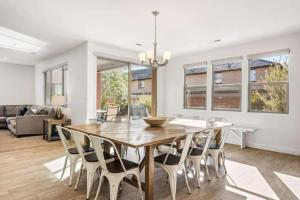 a dining room with a wooden table and chairs at Desert Solitaire #101 in Santa Clara