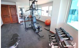 a room with a gym with chairs in it at Apartamento torres del lago in Cartagena de Indias