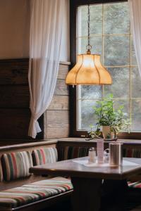 a dining room with a table and a window at Hotel Bären in Feldkirch