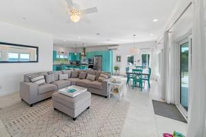a living room with a couch and a table at Bella Mer home in Savannah Sound