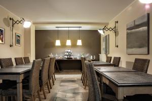 a dining room with wooden tables and chairs at Guest House DaLù in Dorgali