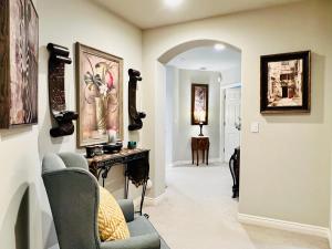 a living room with a chair and a fireplace at Lucy’s Elegant & Cozy House in Sammamish