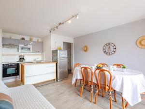 a kitchen and dining room with a table and chairs at Apartment Les Coraux by Interhome in Agay - Saint Raphael +19 photos