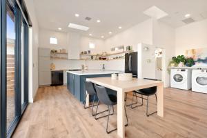 a kitchen with a table and chairs in a room at Back Haus - Views, Dark Skies and Fire Pit! home in Joshua Tree