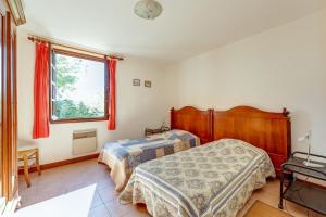 Llit o llits en una habitació de Maison de 3 chambres avec piscine partagee jardin clos et wifi a Lagrasse