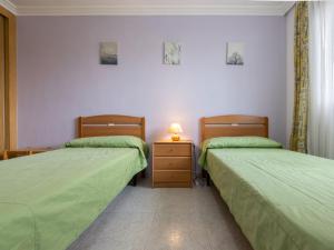 Postel nebo postele na pokoji v ubytování Apartment Aguamarina 7 by Interhome