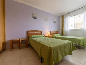 Postel nebo postele na pokoji v ubytování Apartment Aguamarina 7 by Interhome