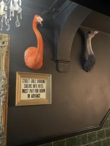 two statues of birds on the wall of a room at The Twenty One B&B in Brighton & Hove