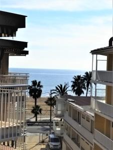 a view of the ocean from the balcony of a building at CAMBRILS BEACH APARTMENT in Cambrils