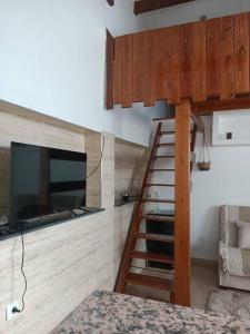 a room with a bunk bed and a television at Appart hôtel cozy in Bouzareah