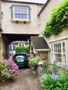 a car parked in front of a house at Garden Cottage in Wetherby