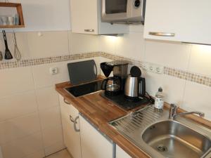 Kuchyň nebo kuchyňský kout v ubytování Apartment Ostsee-Residenz - DMP173 by Interhome