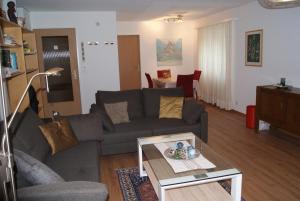 a living room with a couch and a coffee table at Haus Richemont in Zermatt