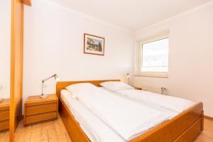 Ein Bett oder Betten in einem Zimmer der Unterkunft Strandnixe 301