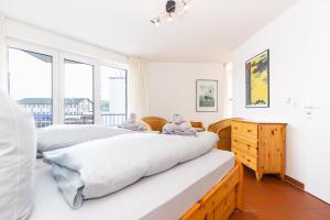 En eller flere senge i et værelse på Marina 28-1