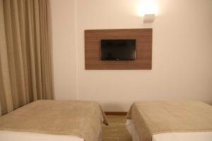 Letto o letti in una camera di Samba Linhares