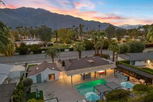 an aerial view of a house with a swimming pool at The Ritz - Luxury Home with Pool & Speakeasy Bar in Palm Springs