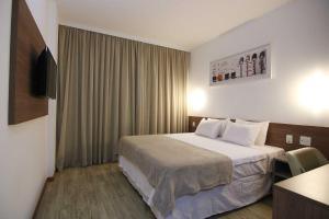 Letto o letti in una camera di Samba Linhares