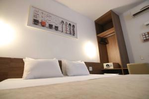 Letto o letti in una camera di Samba Linhares