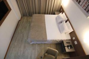 Letto o letti in una camera di Samba Linhares
