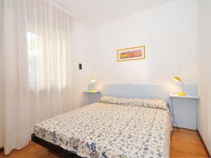 En eller flere senge i et værelse på Apartment Villa Friuli-1 by Interhome