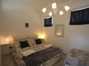 Posteľ alebo postele v izbe v ubytovaní Apartment Giulia by Interhome
