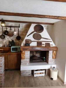 a living room with a fireplace in a house at Apartman Lidija in Makarska
