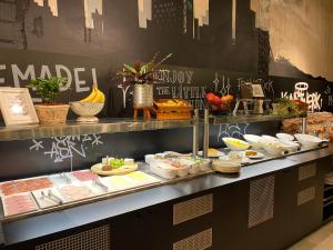 a buffet line with various food items on display at Catalonia Berlin Mitte in Berlin